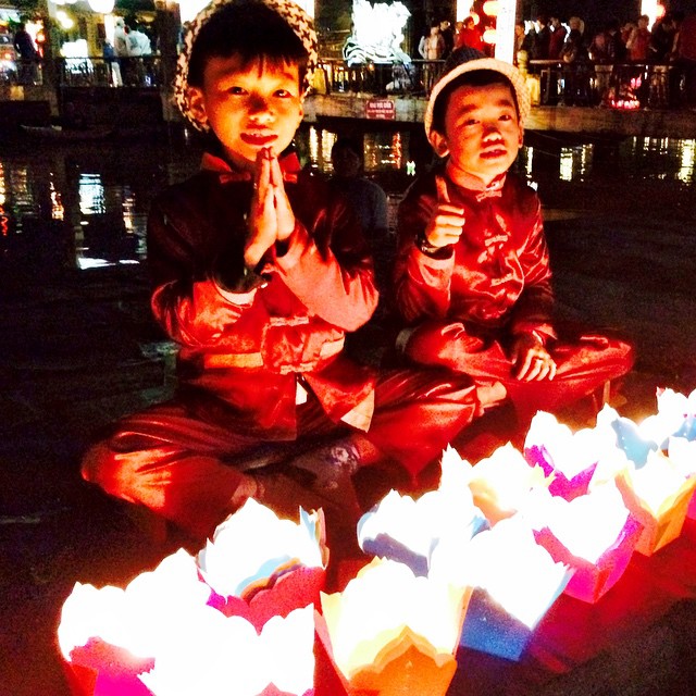 Boys selling lanterns along the Thu Bon River in Hoi An Ancient Town, #Vietnam. #travel #culture