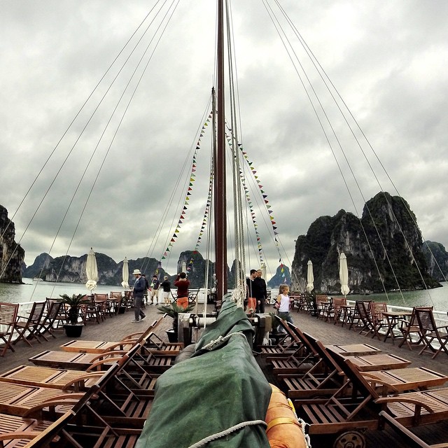 #Chinese-style #junk boat taking tourists to explore the waters of #Vietnam's #Halong #Bay, famous for its hundreds of tiny, uninhabited #islands. See the #dark #storm #clouds? Port authorities in Halong #City prohibited boats from overnighting in the bay yesterday due to strong monsoonal #winds coming in off the #Gulf of #Tonkin.  #monsoon #weather #asia #sail #boat #travel #karst #dragon