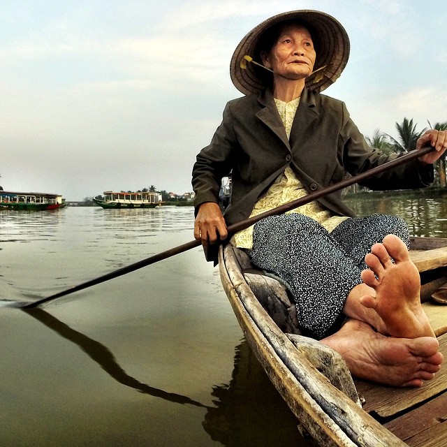 Vietnamese woman rowing her #boat on the Thu Bon River in Hoi An, #Vietnam. #travel