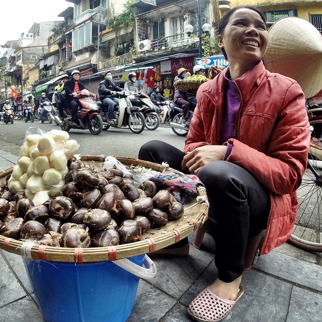 Woman selling water chestnuts on the street in #Hanoi, #Vietnam. #travel