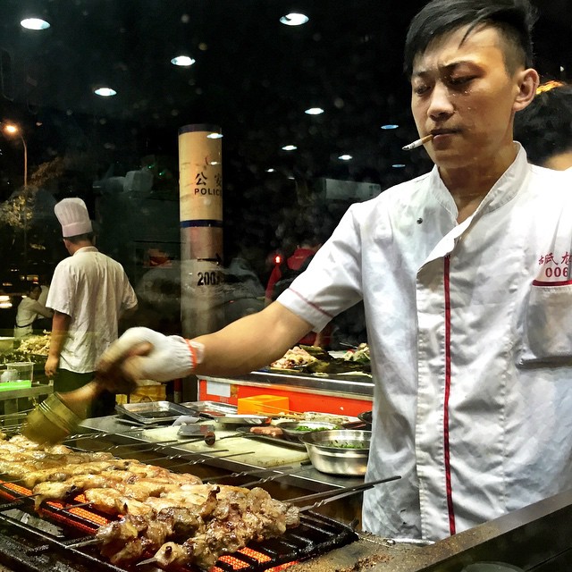 Street food in #China: grilled chicken, frogs, and sheep testicles. Nothing like a chef who cooks your food while smoking a cigarette. #Shanghai #food