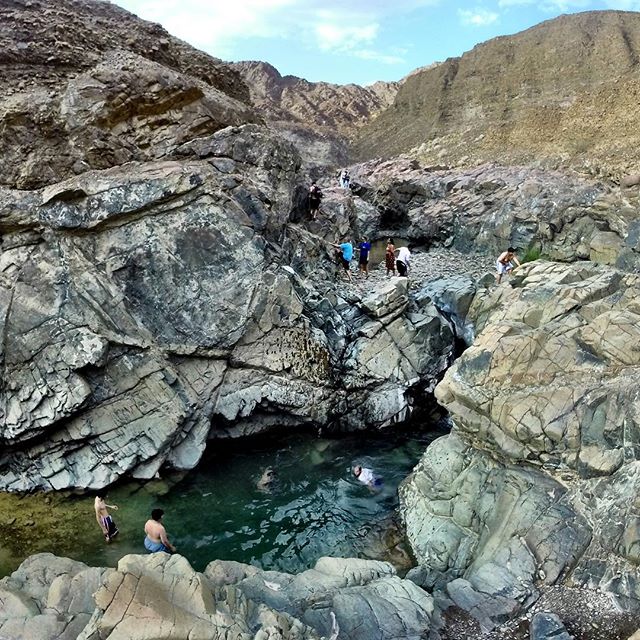 Young Omanis cool off with a dip in the natural pools at Wadi Madbah in the mountains east of Al Ain. #Oman #UAE #travel #nature