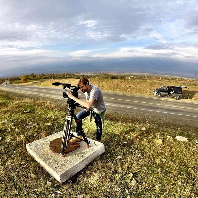 CNN's @alskene filming the sunset in Kakheti, Georgia's wine country. The Caucasus are just behind our car in the distance. Dagestan, Russia is just behind the mountains. #CNN #cnnsilkroad #Georgia #russia #wine #sunset