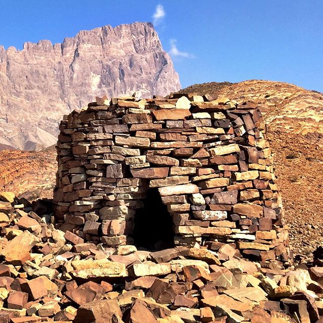 One of the "beehive" tombs at Al-Ayn, Oman, with Jebel Misht in the background. The archeological site is one of the most well-preserved necropolises in the world from the 3rd millenium B.C. #Oman #beehive #tomb #archeology #travel